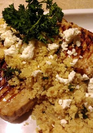 A picture of Lemon Herb Couscous With Grilled Pork Chops.