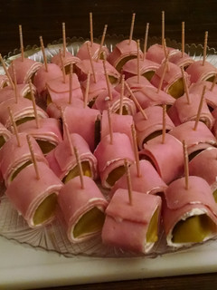 A picture of Ham and pickle Hors D'oeuvre.