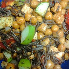 A picture of Black noodles and veggies.