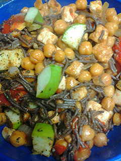A picture of Black noodles and veggies.