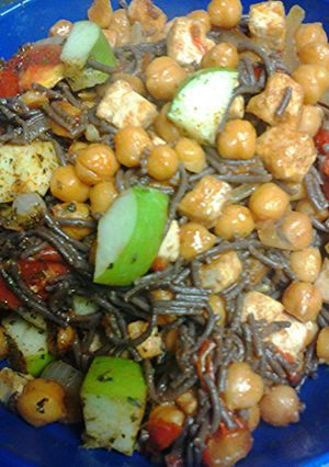 A picture of Black noodles and veggies.