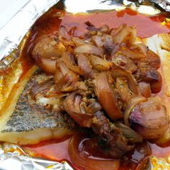A picture of Baked Spicy Hallibut In Banana Wrap.