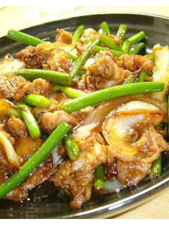 A picture of Pork & Garlic Shoots Twice-Cooked Pork-Style Fry.