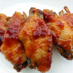 A picture of Chicken Wings And Sausage In Whisky Sauce.