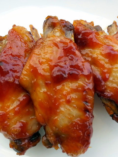 A picture of Chicken Wings And Sausage In Whisky Sauce.