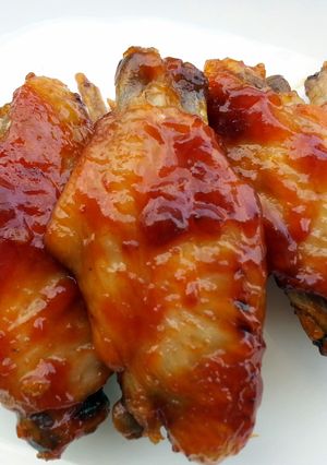 A picture of Chicken Wings And Sausage In Whisky Sauce.