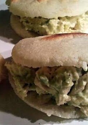 A picture of Chicken sandwich with avocado (Arepa/Renia Pepiada).