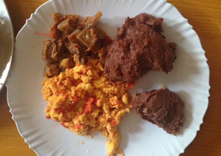 Left over beef and scrambled eggs served with brown ugali