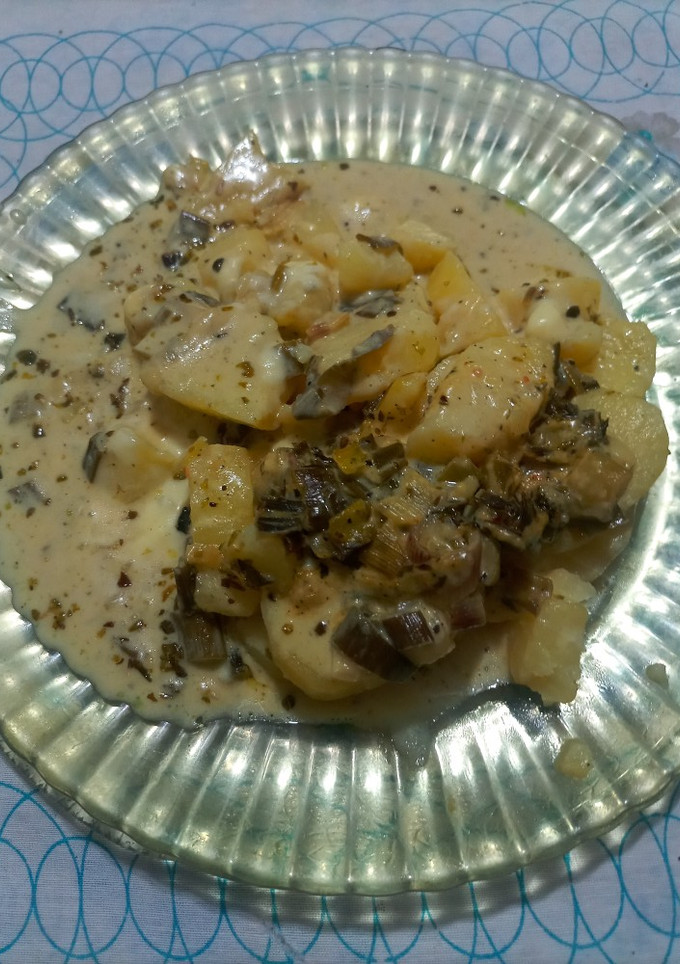 Una foto de Colchón de papas con salsa de verdeo