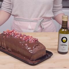 A picture of Yogurt pound cake with chocolate and extra virgin olive oil icing.