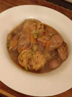 A picture of Sausage and dumpling stew.
