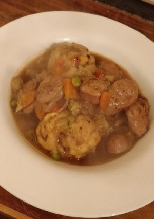 A picture of Sausage and dumpling stew.