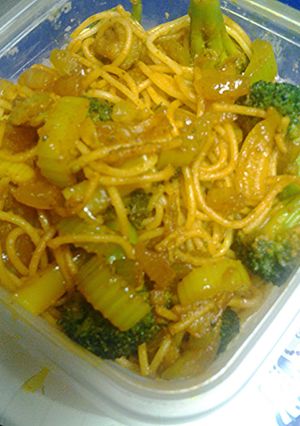 A picture of Golden noodles with bits of Emeralds.