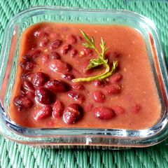 A picture of Red beans in tomato gravy.