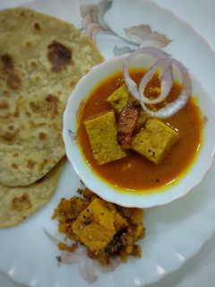 A picture of "Besan dhokli sabji with ghee Paratha and caramelized dhokli".