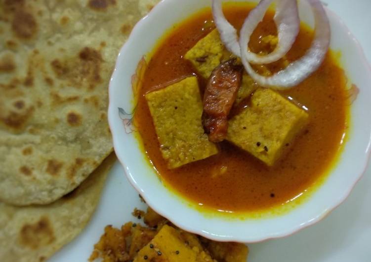 Recipe of Homemade Besan dhokli sabji with ghee Paratha and caramelized dhokli