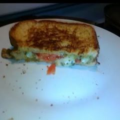 A picture of Grilled Cheese with pesto & mozzarella.