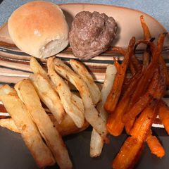 A picture of Meatloaf Balls w/roasted carrots & potatoes.