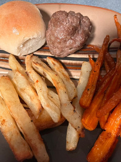 A picture of Meatloaf Balls w/roasted carrots & potatoes.