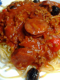 A picture of linguine in meat sauce.