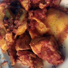A picture of chicken with cheese ravioli.