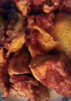A picture of chicken with cheese ravioli.