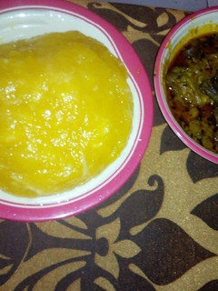 A picture of Goat meat Banga soup and starch.
