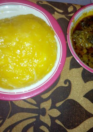 A picture of Goat meat Banga soup and starch.