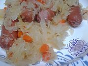 A picture of sauerkraut and hot dogs