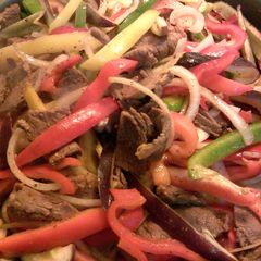 A picture of beef or chicken fajitas.