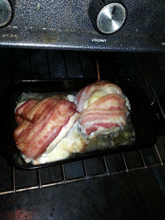 A picture of Bacon wrapped swiss chicken breasts.