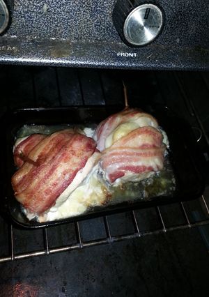 A picture of Bacon wrapped swiss chicken breasts.