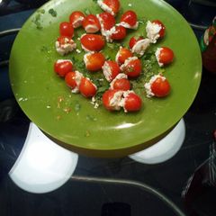 A picture of Stuffed cherry tomatoes.