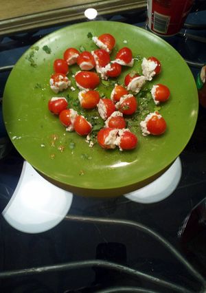 A picture of Stuffed cherry tomatoes.