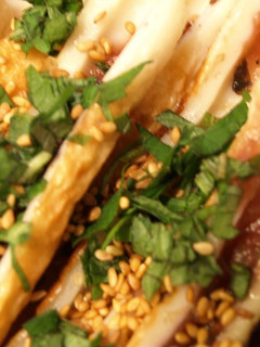 A picture of Umeboshi Filled Chikuwa Topped with Shiso Leaves and Sesame Seeds.