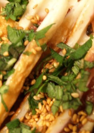A picture of Umeboshi Filled Chikuwa Topped with Shiso Leaves and Sesame Seeds.