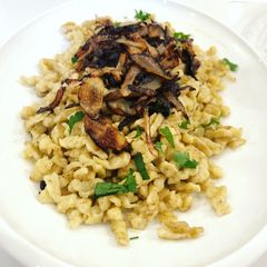 A picture of Spaetzle with Butter, Fried Onion, and Gruyere Cheese.