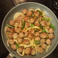 A picture of Italian sausage with pepper/onions.