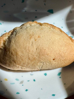 A picture of Mango Pineapple Empanada.