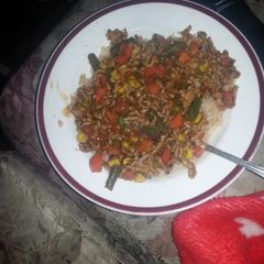 A picture of Anything stir fry and spiced rice.