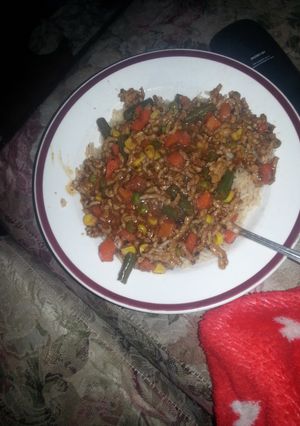 A picture of Anything stir fry and spiced rice.