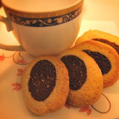 A picture of Black and white tea party cookies.