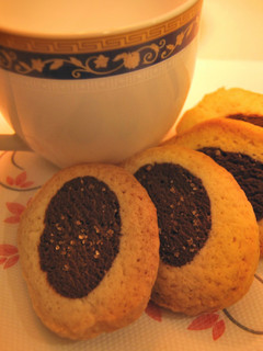 A picture of Black and white tea party cookies.