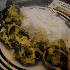A picture of Broccoli with cheese on Mushroom.