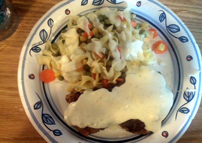 chicken fried steak with gravy and egg noodles