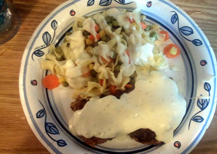 Fresh chicken fried steak with gravy and egg noodles