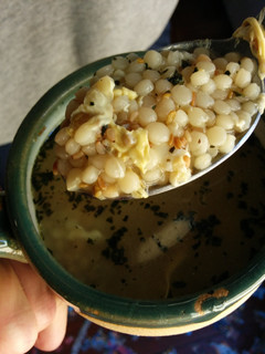 A picture of Basil egg drop couscous soup.