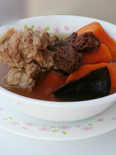 A picture of Carrot And Sour Plum In Pork Soup.