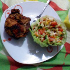 A picture of Roasted chicken and salad.