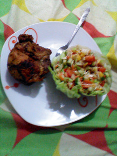 A picture of Roasted chicken and salad.